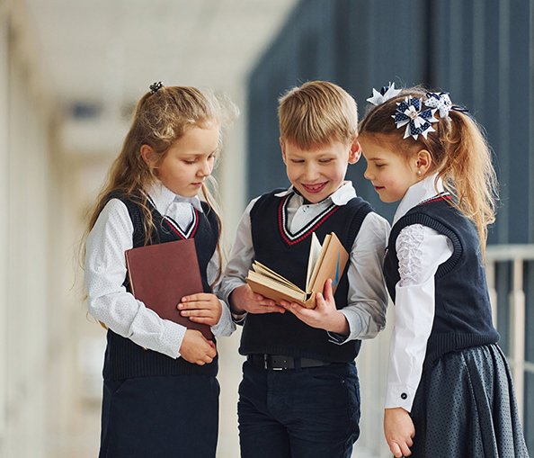 Students learning together in a bright classroom